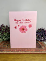 pink card with scattered gerbera daisies 