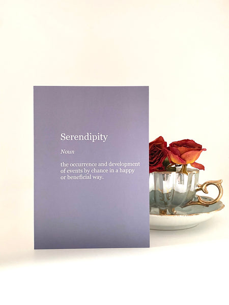 serendipity definition on blue grey background